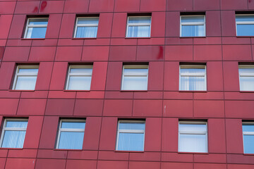 a red office building with large windows