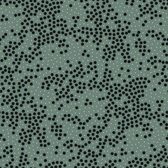 Vector seamless pattern. Scattered tiny circles. Stylish structure of natural dots. Hand drawn abstract background. Can be used as swatch in Illustrator. Green minimal print.