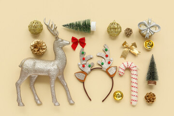 Christmas reindeer antlers headband with decor on beige background