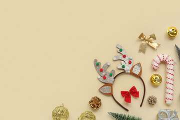 Christmas reindeer antlers headband with decor on beige background