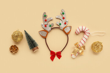 Christmas reindeer antlers headband with decor on beige background