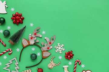 Christmas reindeer antlers headband with decor on green background