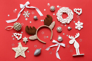 Christmas reindeer antlers headband with baubles and snowflakes on red background