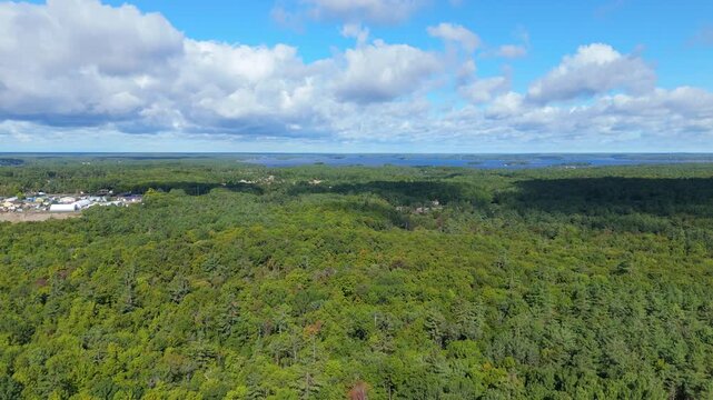 Rising Aerial Shot Of Pristine Forest And Gull Lake At Gravenhurst In Muskoka, Ontario, Canada.