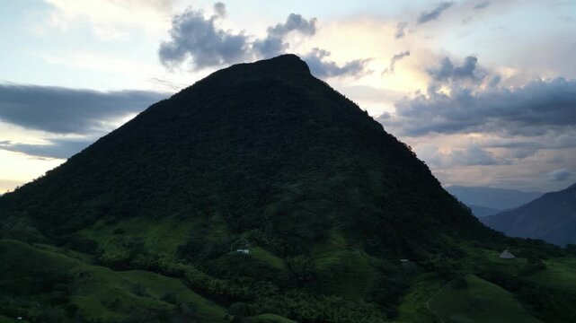 Aerial view of Cerro Tusa, the pyramid-shaped mountain near Venecia in the Antioquia region of Colombia, rising from the surrounding highlands of the Western Andes at sunset