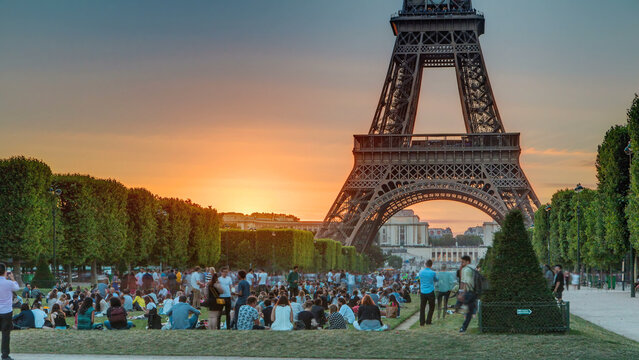 Eiffel Tower seen from Champ de Mars at sunset timelapse, Paris, France - Powered by Adobe