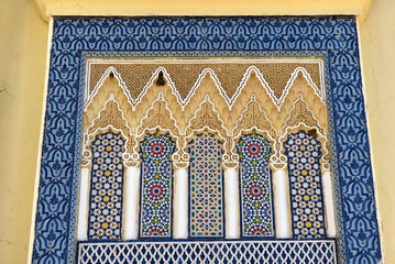 Architectural detail in Fez Royal palace, Morocco. Carved stone and mosaic tilework