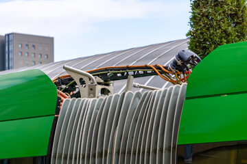 Electric bus charging connector with high-voltage cables and technical detail of public transport...