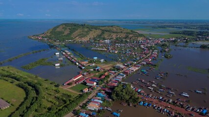Drone view of floating village on Tonle Sap Lake, tranquil and serene