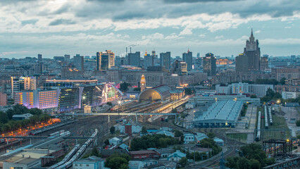 Obraz premium Panoramic view to Kiev Railway Station night to day timelapse and modern city in Moscow, Russia