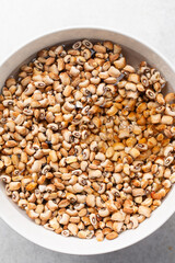 Overhead view of beans being washed, top view of honey beans being washed to make nigerian moi-moi or bean cake