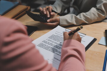 Consultation and conference of professional businesswoman and Male lawyers working and discussion having at law firm in office. Concepts of law, Judge gavel with scales of justice