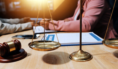 Consultation and conference of professional businesswoman and Male lawyers working and discussion having at law firm in office. Concepts of law, Judge gavel with scales of justice