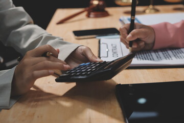 Consultation and conference of professional businesswoman and Male lawyers working and discussion having at law firm in office. Concepts of law, Judge gavel with scales of justice
