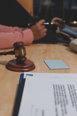 Consultation and conference of professional businesswoman and Male lawyers working and discussion having at law firm in office. Concepts of law, Judge gavel with scales of justice