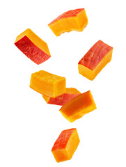 Rectangular slices of red pumpkin falling through space. Isolated on white.