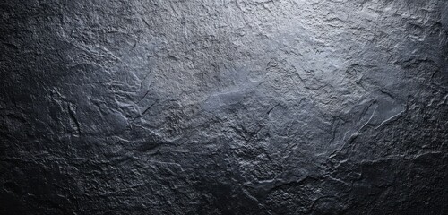 Close-up of rough textured dark stone with natural irregularities
