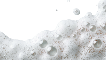 Close-up photo of bubbly white foam, with varied sized translucent bubbles and a black background