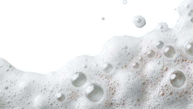 Close-up photo of bubbly white foam, with varied sized translucent bubbles and a black background