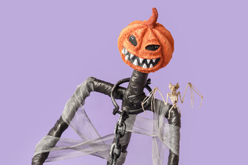 Spooky Halloween monster with bat skeleton on lilac background