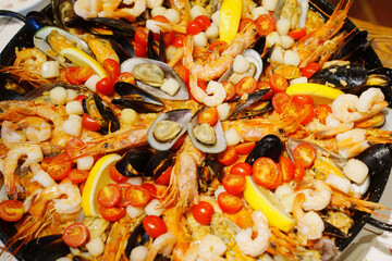Colorful seafood dish prepared with shrimp and mussels at a festive gathering