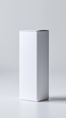 Naklejka premium Plain white rectangular box standing upright on a neutral gray background. 