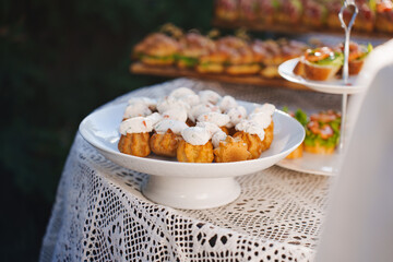 Delicious mini desserts on a table at a festive outdoor gathering