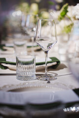 Elegant table setting with glassware and floral decorations for a special event