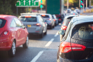 Traffic jam congestion with rows of cars on highway or motorway in rush hour