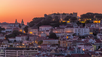 Lisbon aerial cityscape skyline night to day timelapse from viewpoint of St. Peter of Alcantara, Portugal