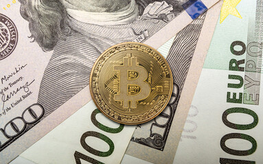 Bitcoin coin placed on top of dollar bills and euro notes in a financial exchange setting