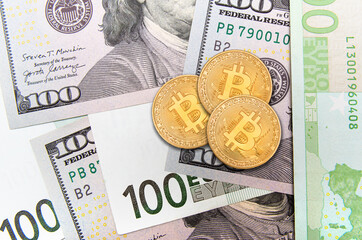 Bitcoin coins placed on US dollar bills showcasing cryptocurrency and its relationship with traditional money
