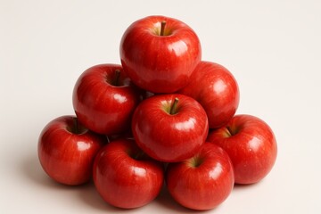 Fresh red apples stacked neatly on white background, perfect for healthy food and nature concepts.