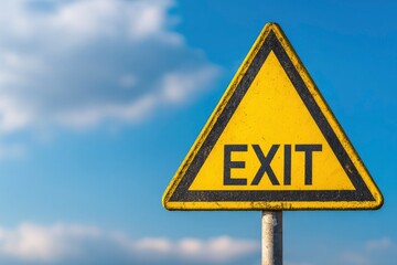 A triangular yellow sign with a black border and the word EXIT in black letters set against a blue sky with clouds