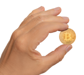 Hand holding a shiny bitcoin coin with clear details in bright lighting