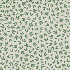 Vector illustration. Seamless pattern of delicate green leaves on a light beige background. Foliage design for fabric, wrapping paper.