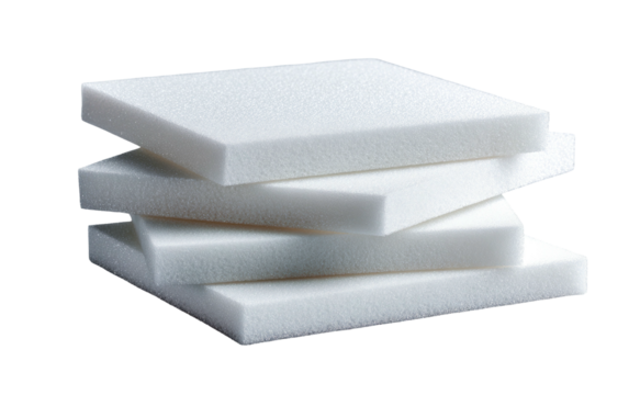 Four white, square foam pads, neatly stacked, with a slightly textured surface and black background