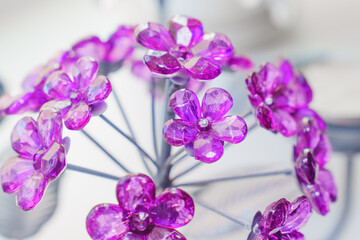 Colorful purple flowers made of crystals in decorative arrangement