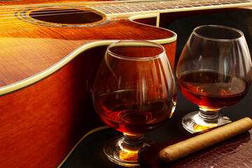 Glass of cognac and on the classic guitar