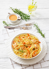 yummy spaghetti with shrimps in a white bowl