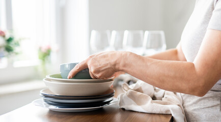 Woman Is Drying Dishes