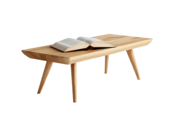 An open book rests on a light-wood, mid-century modern style coffee table against a pure black background