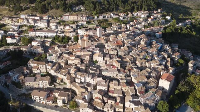 Drone aerial view of Castel del Monte, Abruzzo, a medieval hilltop village with ancient stone architecture and panoramic landscapes