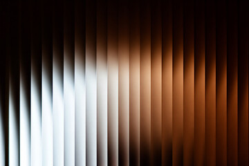 Vibrant orange and white gradient with a vertical striped texture.