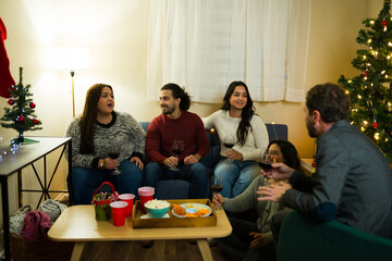 Party guests celebrating christmas holiday reunion at home