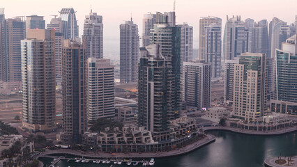 Dubai marina harbor panorama from night to day transition timelapse