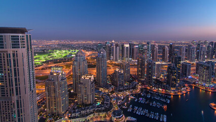 Fototapeta premium Dubai Marina with yachts day to night aerial timelapse