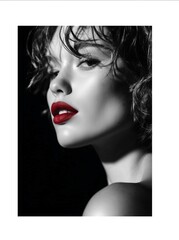 Black and white photo of a model with bright red lips and a stylish haircut. Advertising for lipstick and a beauty salon.