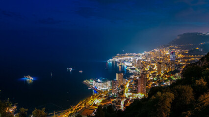 Aerial top view of Monaco from the grand corniche road day to night timelapse, Monaco France
