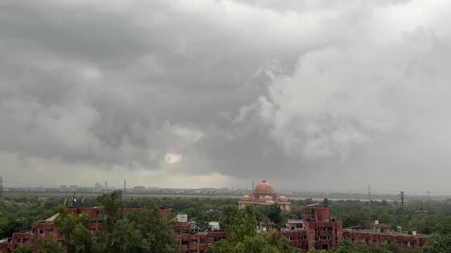 Moving Clouds Over Dr Ambedkar Park Monument. Noida Stormy Skies with New Delhi Dramatic Weather. Historic Architecture Lush Green Urban View. Cinematic Rainy Landscape India Dome Landmark Atmospheric